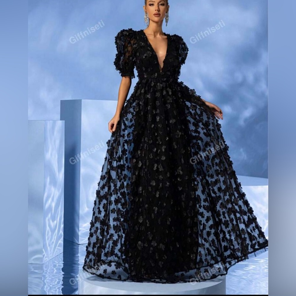 Black maxi with floral pieces attached